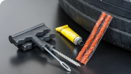 Tyre repair material and tool Tyre repair material and tool