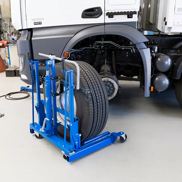 AC Hydraulic WTA500 Commercial Wheel Trolley – 500kg Capacity AC Hydraulic WTA500 lifting a heavy truck wheel in an Irish commercial vehicle workshop
